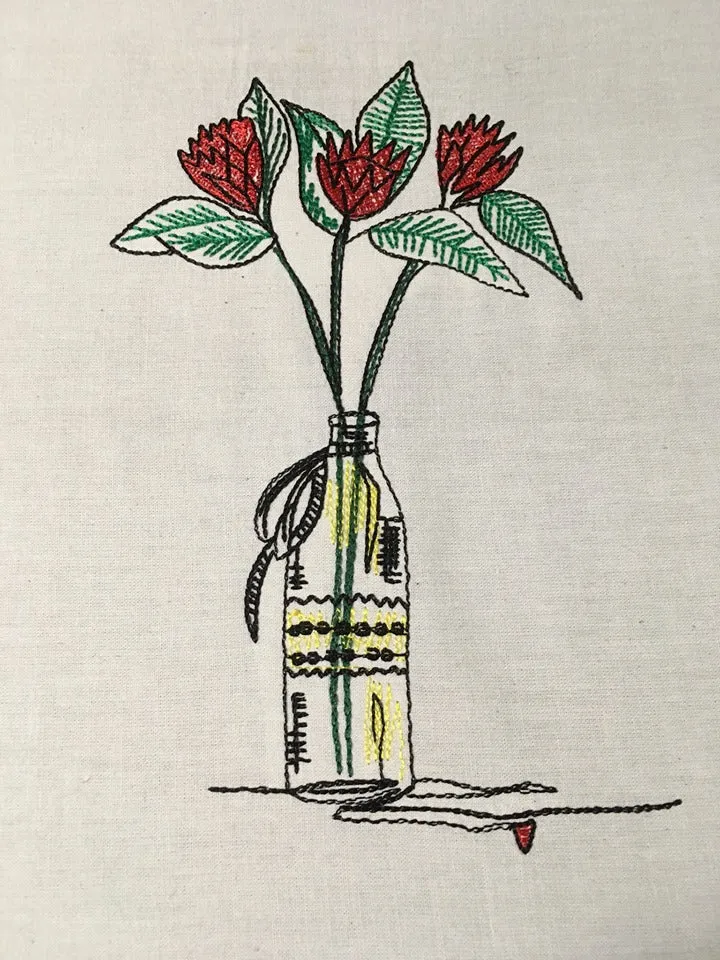 Red Summer flowers in a bottle